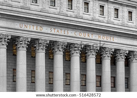 inscription on the courthouse close-up Royalty-Free Stock Photo #516428572