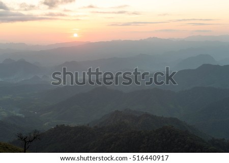 Sunset with silhouetted mountains at Mon Thu Le, Tak province, Thailand