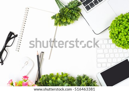 Top view white business desk with office object and green flower trendy for montage your advertise.