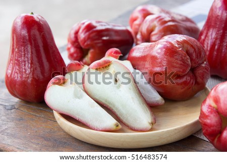 rose apple , Thailand apple fruit flavors of sweet red gloss.  rose apple on background Royalty-Free Stock Photo #516483574