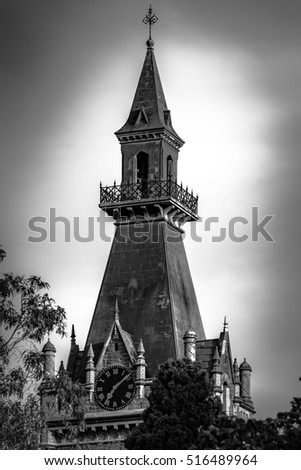 The clock tower of Ormond College in black and white at the University of Melbourne, Australia