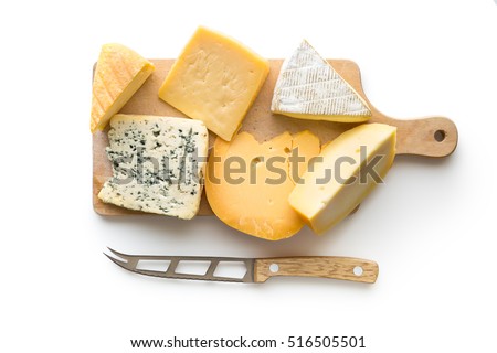 Different kinds of cheeses isolated on white background. Top view. Royalty-Free Stock Photo #516505501