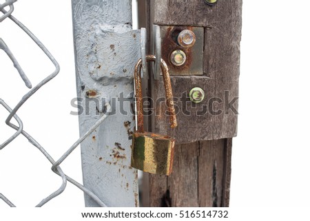 Rusty open lock on an old wooden door

