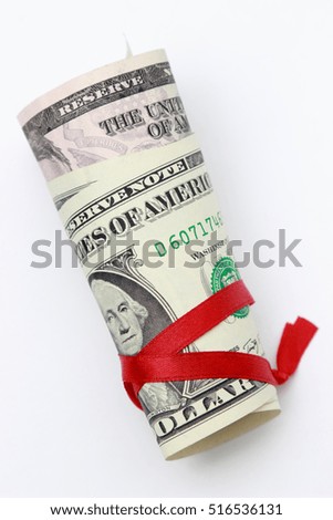 American dollars and red ribbon on Holiday/USA cash money