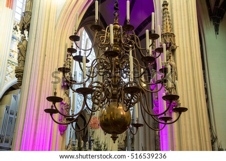 Chandelier with candles in the cathedral Dutch city of Den Bosch
