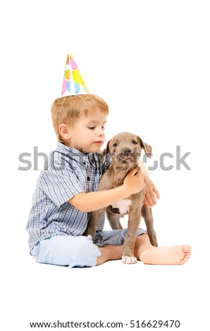Boy and puppy pit bull of given a present to birthday isolated on white background
