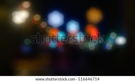 Christmas fair - out-of-focus bokeh background with illuminated snowflakes