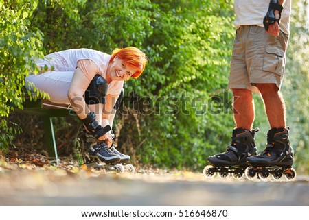 Active senior couple after rollerblading in the summer