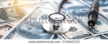Healthcare cost concept with stethoscope and dollars 
background
 Royalty-Free Stock Photo #516662110