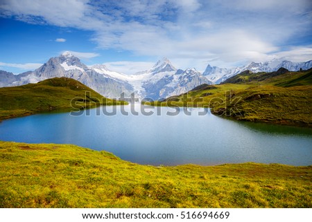 Great view of Mt. Schreckhorn and Wetterhorn above Bachalpsee lake. Dramatic and picturesque scene. Popular tourist attraction. Location Swiss alp, Bernese Oberland, Grindelwald, Europe. Beauty world