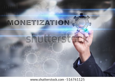 Businessman is drawing on virtual screen. monetization concept