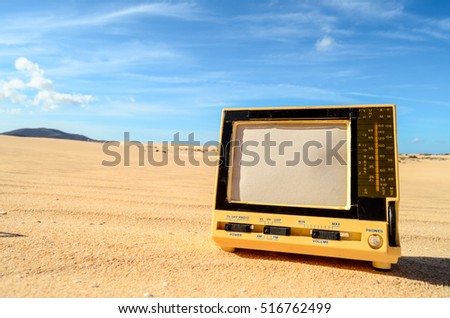Conceptual Photo Picture of a Television Object in the Dry Desert