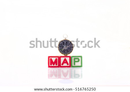 Compass on map wording with reflection