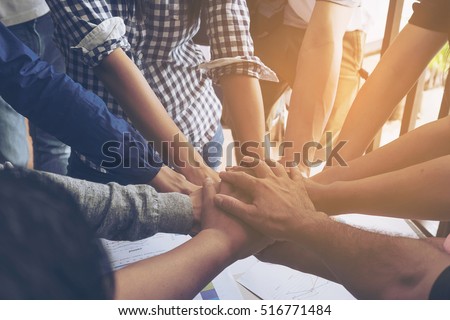 Business people join hand together during their meeting Royalty-Free Stock Photo #516771484
