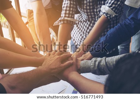 Business people join hand together during their meeting Royalty-Free Stock Photo #516771493