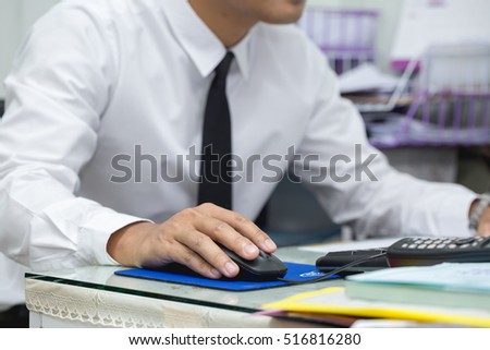 Close up hand of business men wear white shirts use the computer in the office