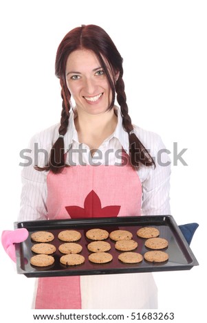 beautiful housewife showing off cakes on white background