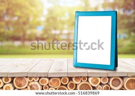 Blank empty blue brochure put on wooden table for text, menu or advertising