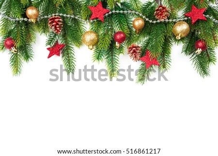 Christmas border with trees, balls, stars and other ornaments, isolated on white. Studio shot