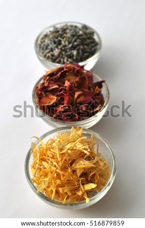 Dried marigold (calendula) petals with lavender and rose for beauty treatments - in clear glass bowls