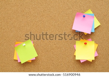 colorful of sticky notes push pins on cork board