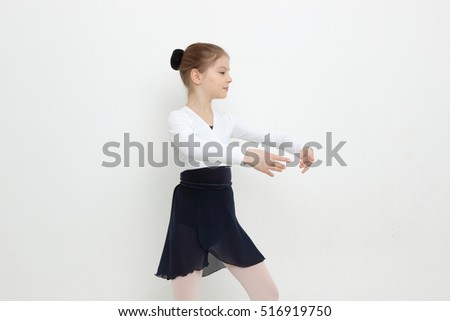 Beautiful caucasian young ballerina is posing on camera
