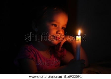 girl with candles Royalty-Free Stock Photo #516933091