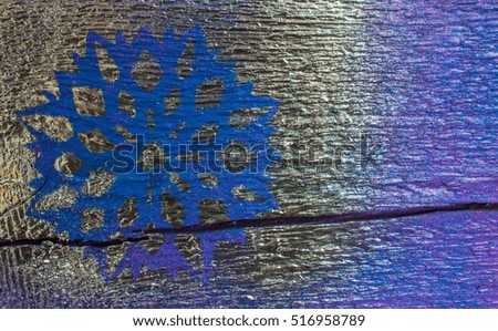 Wooden background with silver snowflakes on a blue and purple background. New Year, Christmas, background, texture.