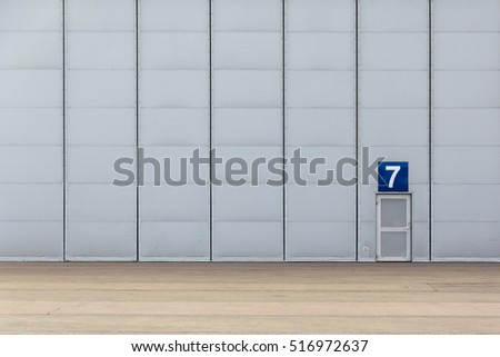 The huge gate of hangar and a small door