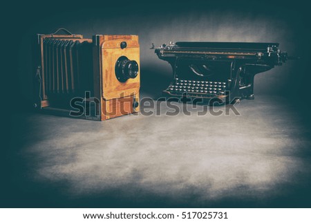 Antique Typewriter and old wooden camera