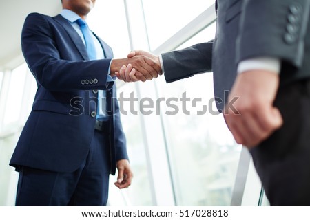 Handshake of partners Royalty-Free Stock Photo #517028818
