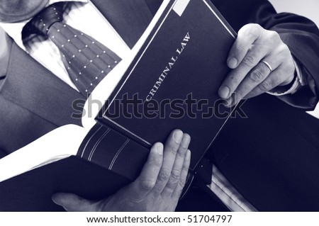 lawyer holding criminal law book, law concept , blue toned