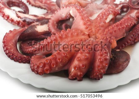 two boiled octopus on a white plate