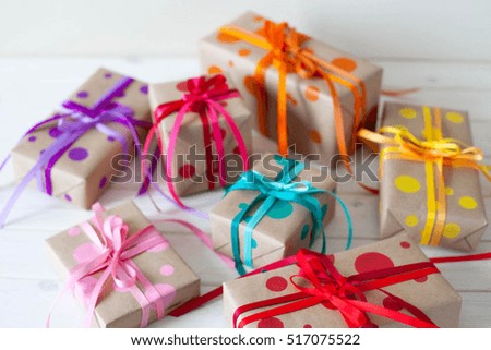 Colored gift boxes, tied with ribbons. Multicolored gifts.