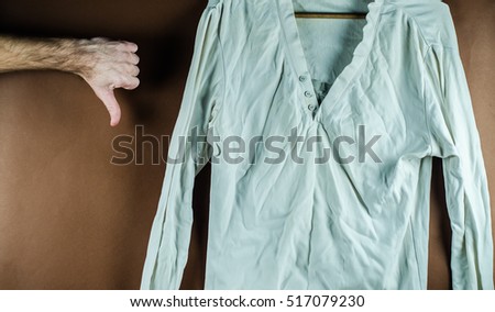iron and white wrinkled shirt