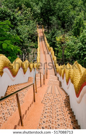 Concrete staircase with Thai's dragon stucco railing