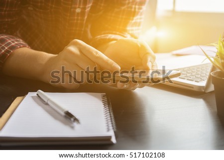 businessman working with modern devices, digital tablet computer and smartphone,Hipster texting message on mobile,selective focus,vintage color Royalty-Free Stock Photo #517102108