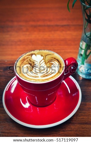 vintage Coffee cup in coffee shop,vintage red Cup of coffee on a wooden table