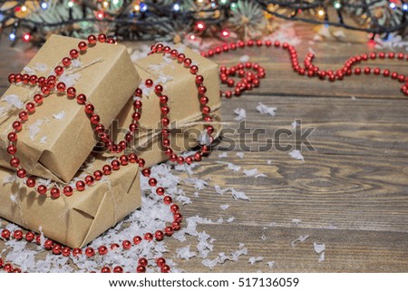 many gifts wound kraft paper, branches ate on a table