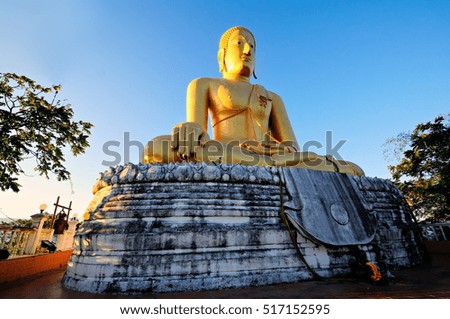 The large sculpture Big Buddha on scenic mountain(Buddha Si-Hing simulation), Phipun District, Nakhon Si Thammarat, with the early morning light/ public Location