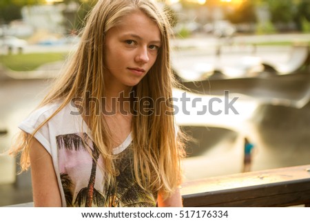 Pretty teen girl  with messy hair looking at camera.