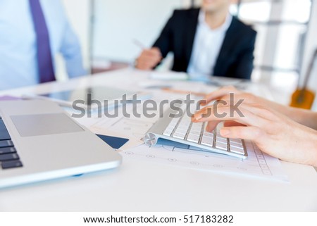 Image of woman's hands typing