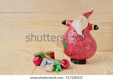 Happy Christmas Santa Claus doll on wooden background