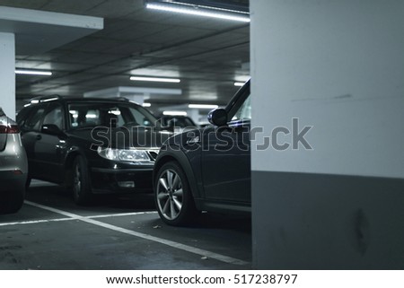 Cars parked in parking garage.
