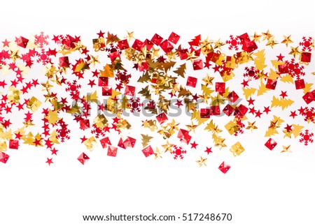 Christmas or New Year background: studded with red and gold sequins in the shape of a Christmas tree, gift and star. Place for your text.