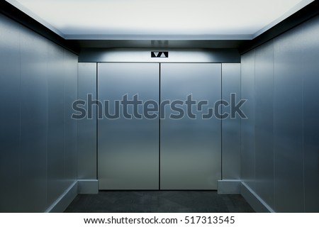 Interior view of a modern elevator Royalty-Free Stock Photo #517313545