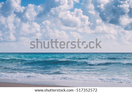 Tropical beach with blue sky and white cloud abstract background. Copy space of summer vacation and business travel concept. Vintage tone color filter style.