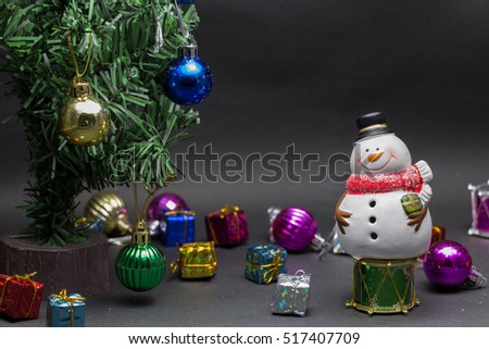 Snowman with christmas tree and disco ball,giftbox,Selective focus,Background for christmas and happy new year