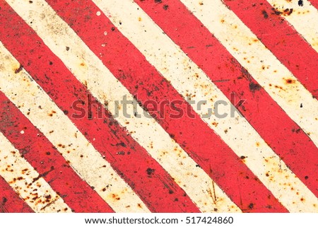 Background of old metal plate in red and white colors, toned photo