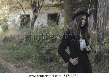 beautiful girl walks in autumn day and reflects on life